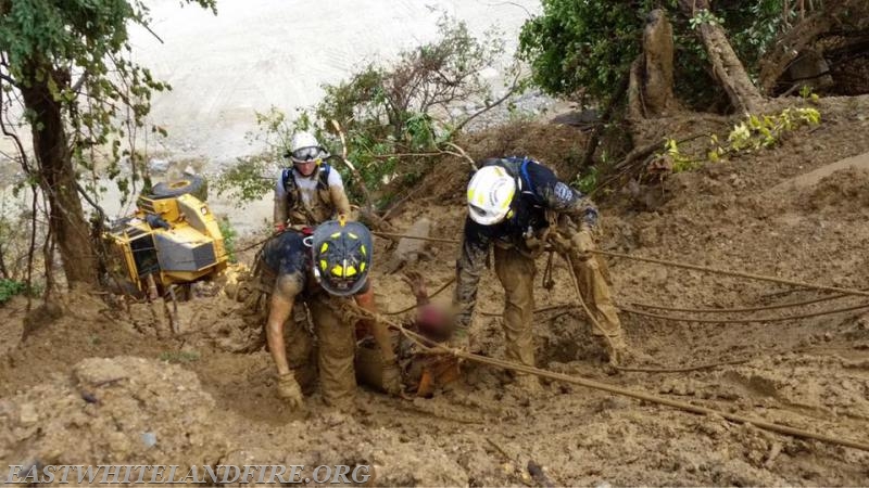 Rescuers bringing dump truck operator to the top rim in severe mud due to heavy rain at Glasgow Quarry. Photo courtesy of Chester County Rescue Task Force.